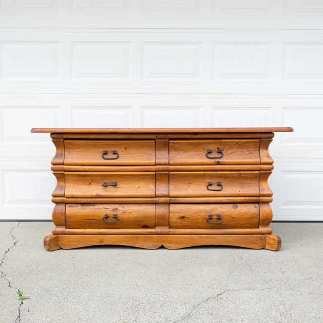 A substantial solid pine six-drawer dresser defined by architectural lines and rich, natural character. Crafted in Mexico...