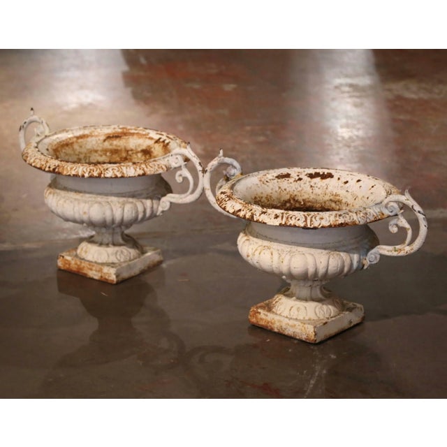 Decorate a backyard with this elegant pair of antique planters. Crafted in the Loire Valley of France circa 1860 in the...