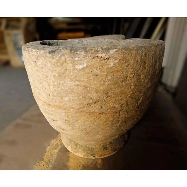 Pair of antique early 20th century hand carved French limestone garden urns.