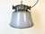 Large heavy industrial hanging lamp made by Elektrosvit in former Czechoslovakia during the 1960s. It features a grey...