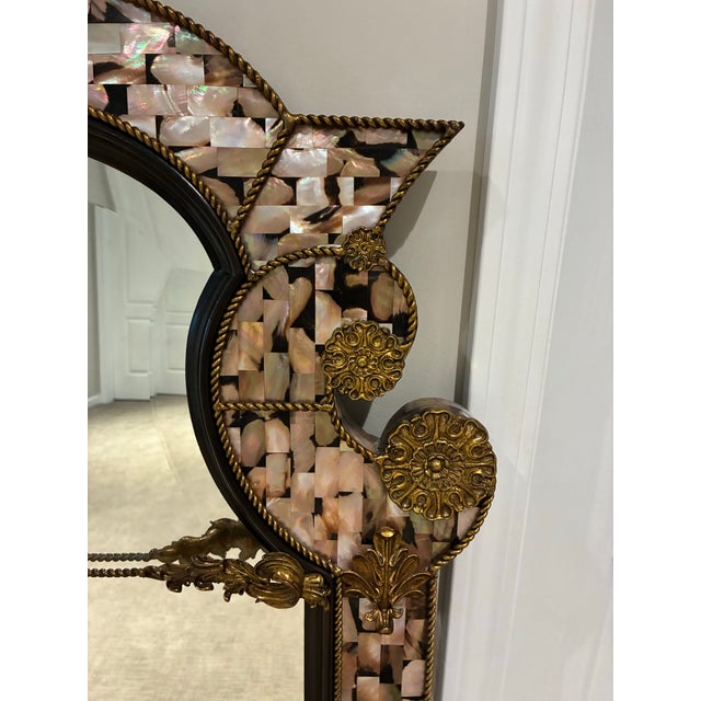 Striking vintage wall mirror by Maitland-Smith, handmade in the Philippines and retaining its original manufacturer’s...