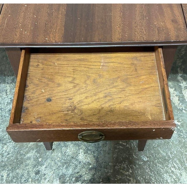Clean lines, honest craftsmanship, and a maker worth knowing. This Tomlinson of High Point drop-leaf side table is a quiet...