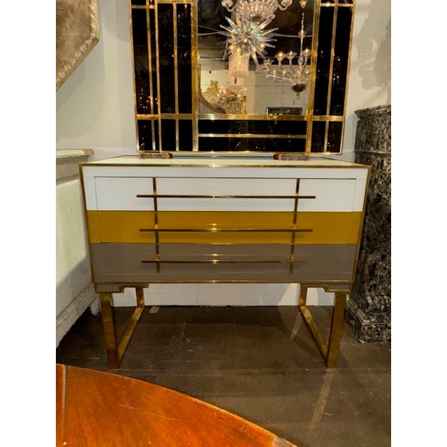Modern Italian designer glass and brass tri-color chest of drawers. Circa 2000. Perfect for today's transitional designs!...