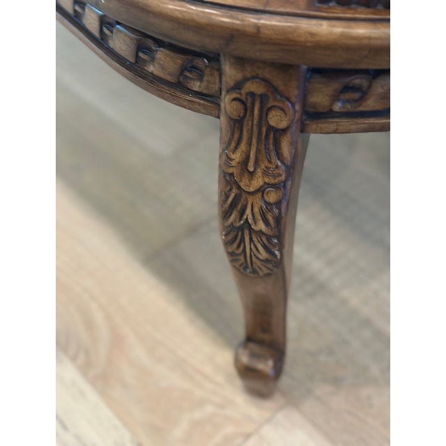 Timeless European elegance meets everyday versatility. This beautifully carved vintage cane bench showcases exceptional...