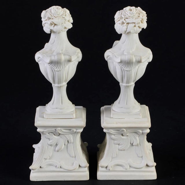 Pair antique 18th century English rococo biscuit porcelain urns on pedestals with bocage flowers at the top. Measure 5...