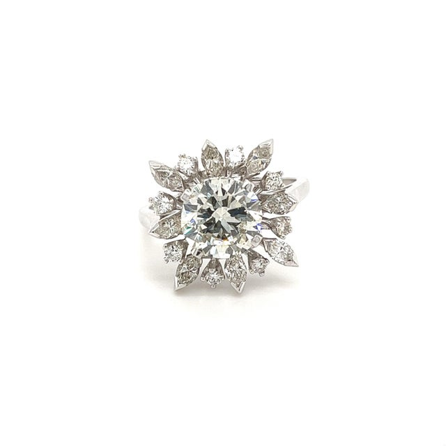 3 carat round cut lab grown diamond set in a platinum diamond halo ring setting. EGL certified and ships overnight from...