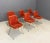Six chairs with chromed metal structure, plastic material and red fabric covering. Italian manufacture. 1960s.