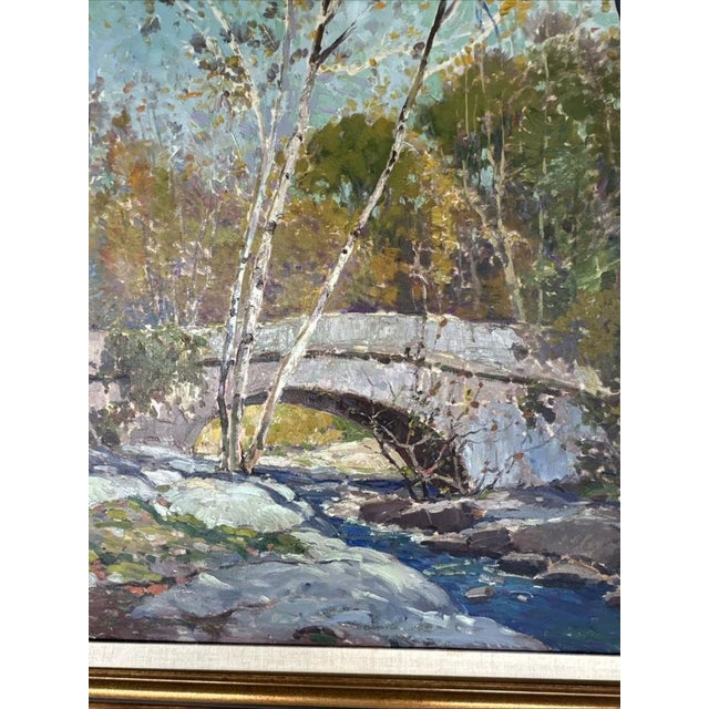 Beautiful landscape oil painting by Anthony Thieme. Titled in verso “ Bridge in Autumn”. Overall measuments are 42.5 w x...