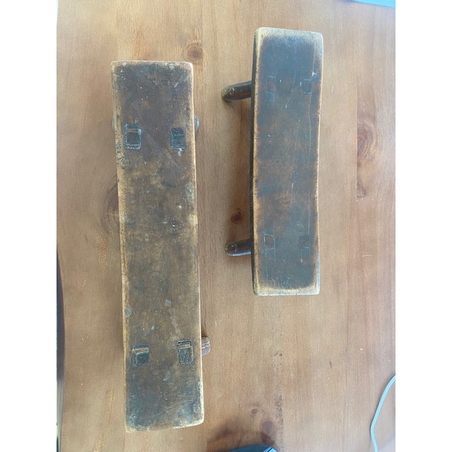 Two traditional wooden headrests, with a rustic, handcrafted appearance. Several characteristics - Solid wood construction...