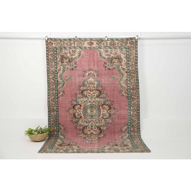Vintage Hand-Knotted runner rug is a semi-antique vintage area rug. The '70s Eastern region of Anatolia's unique rug is...