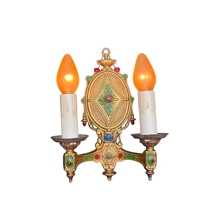 Cast aluminum wall sconces with their original gold paint with red and green highlights. New candle sleeves. All new wire...