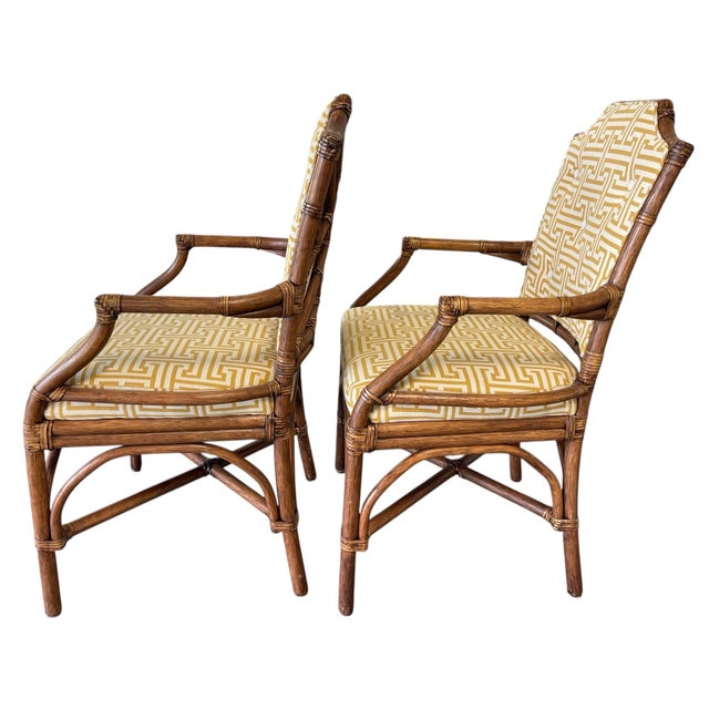 A sculptural pair of Pavilion armchairs by Palecek, featuring hand-wrapped rattan frames with distinctive lattice backs...