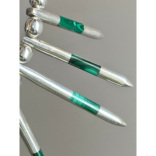 Bold and sculptural collar necklace handcrafted in Taxco, Mexico, featuring a dramatic fan of tapered sterling silver...