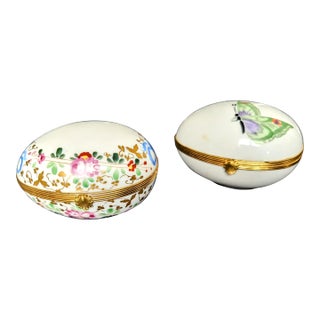 Pair of Early 20th Century Butterfly and Floral Limoges Egg Shaped Boxes For Sale