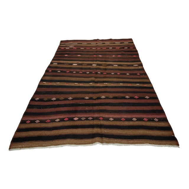 Handwoven vintage Striped kilim rug from Kars region of Turkey. Approximately 50-60 years old. In very good condition