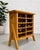 Scandinavian Mid Century Modern Pine Wine rack featuring a floating leg design, c. 1970’s. Made from solid pine and holds...