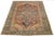 This hand-knotted wool Persian Heriz rug showcases a stunning allover pattern in shades of blue, brown, and ivory on a...