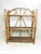 Antique English Tiger bamboo shelves, c.1900 A three tier bamboo shelf stand that can either be hung on a wall or sit on a...