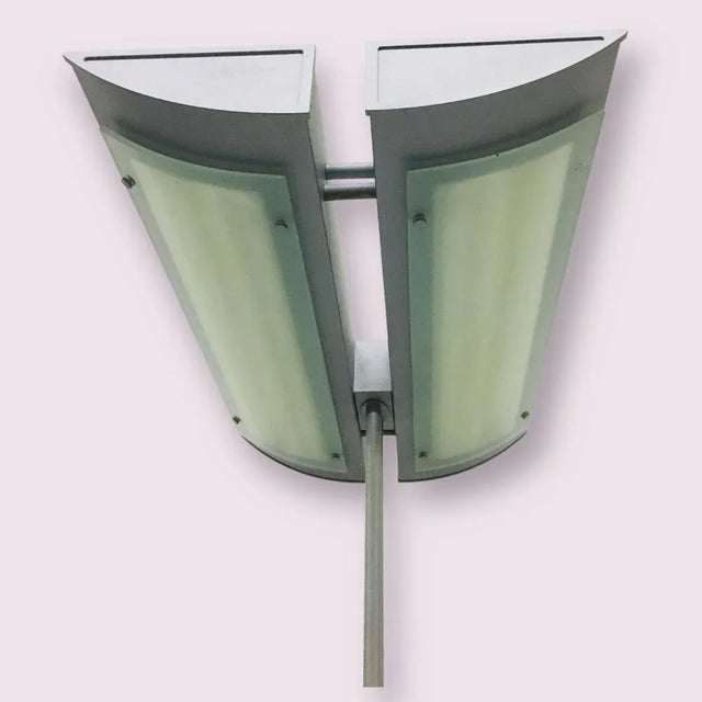 Modern floor lamp in gray metal from the 1980s. A special large floor lamp with a futuristic appearance, on a long...