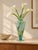 A striking vintage Murano art glass vase by Milano Lavorazione, featuring a translucent aqua-blue body with expressive...