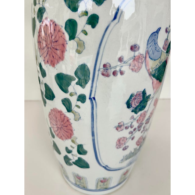 Vintage Chinoiserie floral vase circa 1970s. Vase has a white body decorated with floral, foliate, medallion and panel...