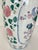 Vintage Chinoiserie floral vase circa 1970s. Vase has a white body decorated with floral, foliate, medallion and panel...