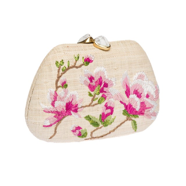 The TAMU clutch is an exercise in sun-soaked glamour, crafted from natural raffia and exquisitely hand-embroidered with...
