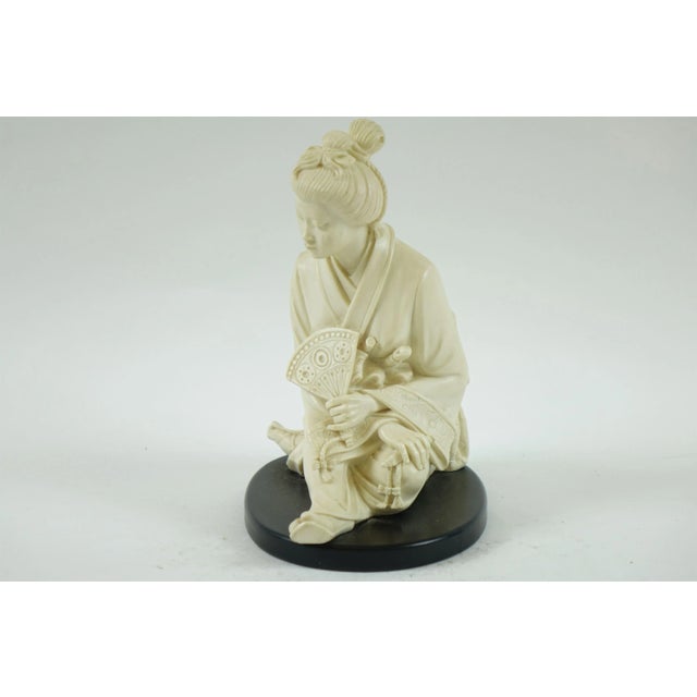 Lovely Ivory Color Composite Japanese Sculpture of a woman with stand.
