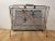 Mid Century Era Magazine Rack. c. 1960's. Tubular gold tone steel frame with contrasting black matte interior nest with...