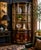 Elegant vintage chinoiserie corner curio cabinet by Union National of Jamestown, New York. This beautifully detailed...