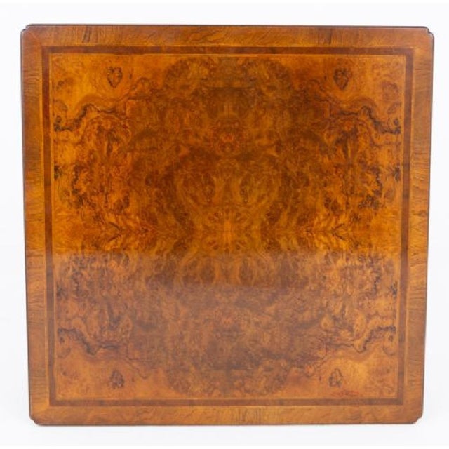 A handsome Carolean-style walnut coffee table of exceptional quality, raised on characteristic turned legs terminating in...