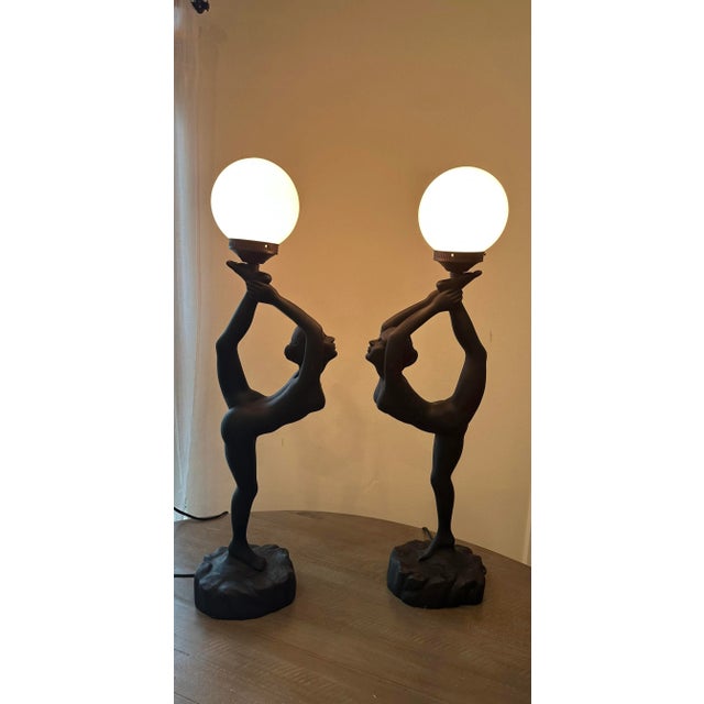 These fabulous lamps are a great find. Made with a heavy base, very sturdy! The round shade is a white porcelain glass....