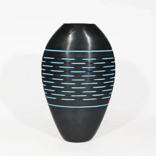 A unique art vase, blown glass incased in turquoise and black outside, Battuto technique by Cenedese. This piece has an...