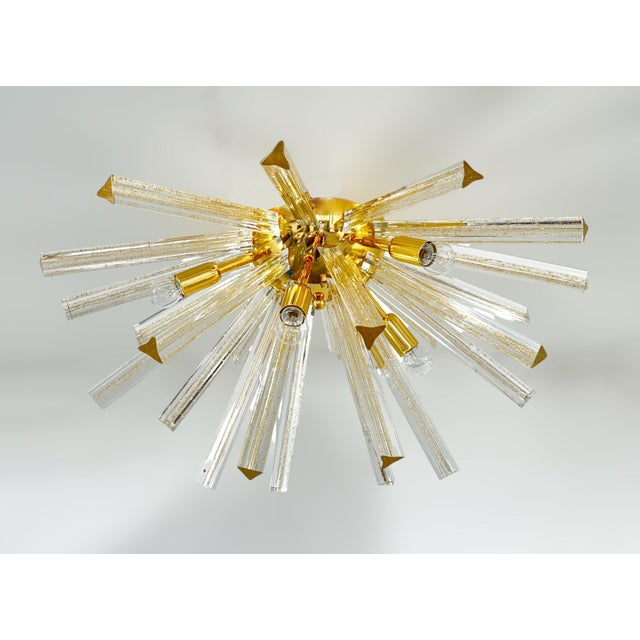 Italian sputnik flush mount with Murano glasses hand blown into three points using Triedri technique and infused with gold...