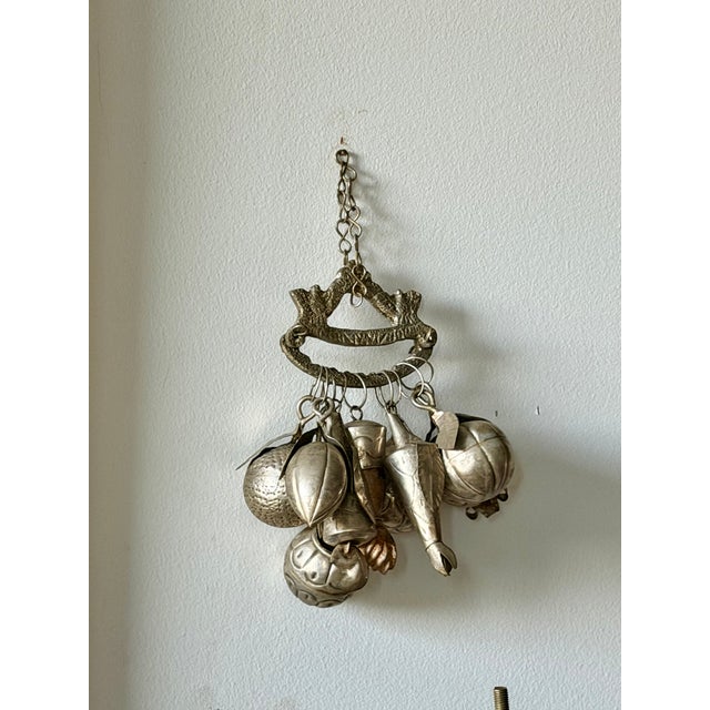 Vintage Brazilian Penca de Balangandãs featuring a collection of silver-tone fruit, botanical and protective charms...