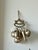 Vintage Brazilian Penca de Balangandãs featuring a collection of silver-tone fruit, botanical and protective charms...
