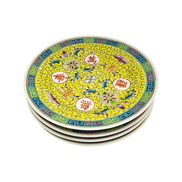 A set of four mid-twentieth-century Jingdezhen porcelain plates, produced in Jiangxi Province, China, circa 1950s–1960s....