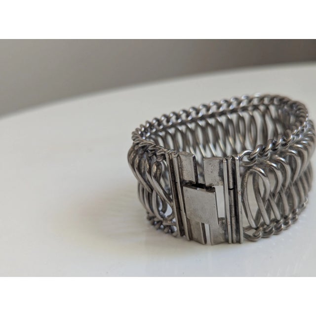 Seller delegated shipping, arrives 4-8 days from purchase. Wide Modernist woven bracelet sometimes called a cuff due to...