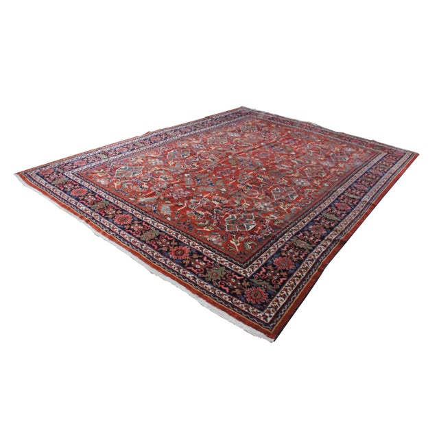A large and Impressive oriental geometric woold area rug. Features a hand knotted pile with geometric foliate designs. The...