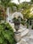 Vintage Classical Cast Stone Garden Urn With Fleur-De-Lis Relief & Weathered Patina For Sale - Image 11 of 12