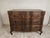 Crafted from solid French oak, this vintage chest of drawers showcases graceful serpentine drawer fronts, hand-carved...