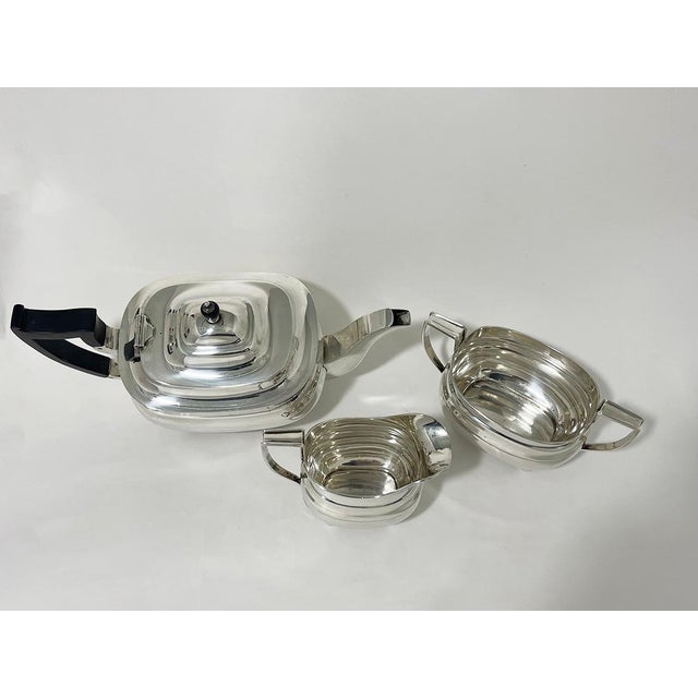 English silver rectangular tea set 1930s a silver tea set with a teapot, sugar bowl and a milk jug in an rectangular shape...