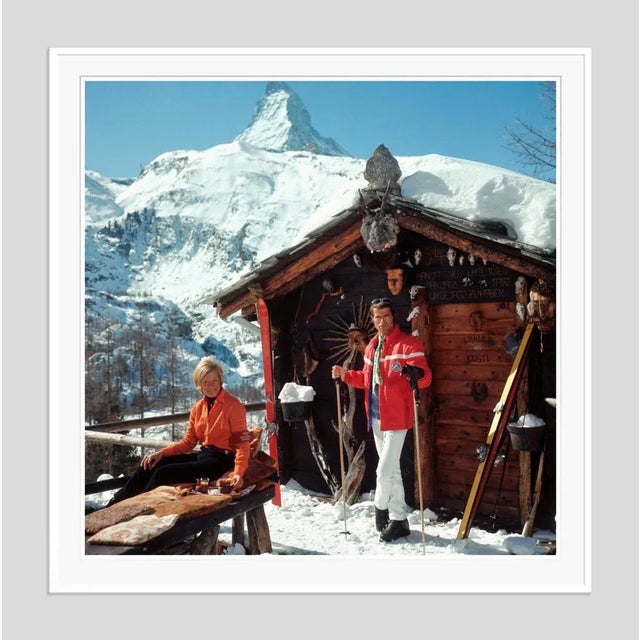 Chalet Costi' by Slim Aarons Open Edition Skiers outside the Chalet Costi in Zermatt, 1968. (Photo by Slim Aarons). An...