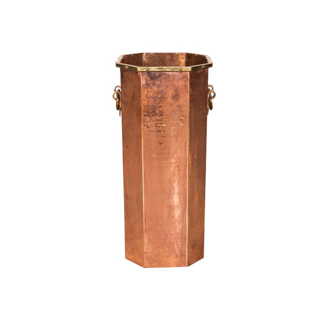 Hand-hammered umbrella stand. Two Brass handles. Brass band trim with small rivets.