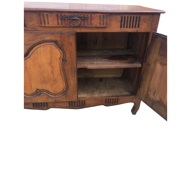 A country French Provincial Louis XV style antique buffet in cherry, with beautifully aged warm rustic patina and original...