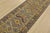 A tribal Caucasian Kazak runner hand-knotted with fine wool on a cotton foundation. This rug features geometric medallions...