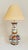 A pair of 20th century delft vase lamps, in a classic garlic neck shape. Each lamp is decorated on an off white ground...