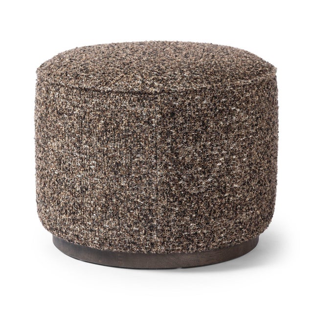 This round ottoman of textural upholstery can be placed just about anywhere, bringing with it a hip retro vibe.