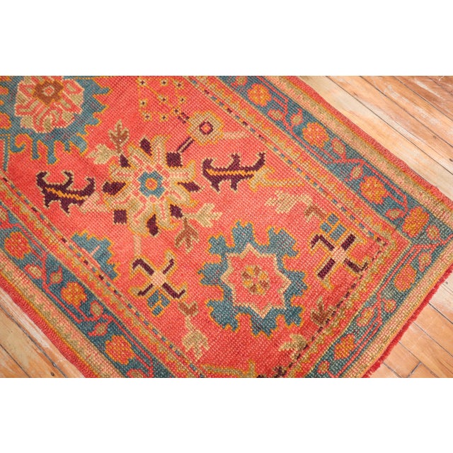 An early 20th century colorful bright orange field long and narrow Oushak Runner. Not many old runners made this long from...