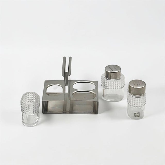 Pitagora cruet set designed by Carlo Mazzeri for Alfra Alessi around 1960, combining Italian lead crystal with a precisely...